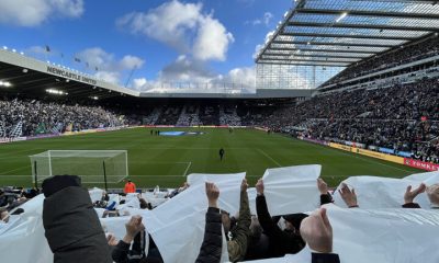 fans holding up black white sheets sjp newcastle united nufc 1120 768x432 1