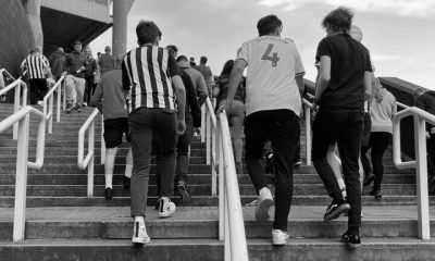 fans walking up stairs to gallowgate end sjp matchday newcastle united nufc bw 1120 768x432 1