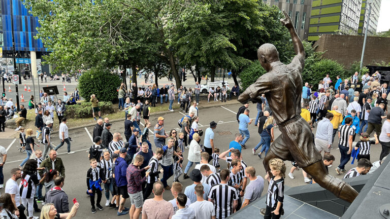 fans looking up at alan shearer statue matchday sjp newcastle united nufc 1120 768x432 2