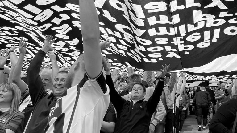 fans under the surfer flag leazes end newcastle united nufc bw 1120 768x432 2