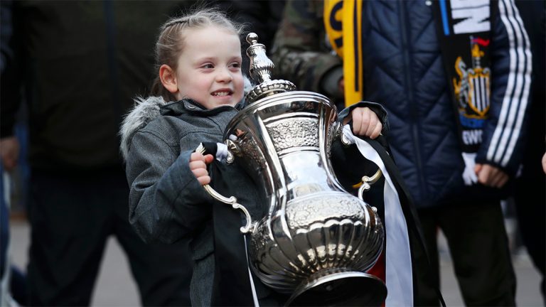 young fan lifting fa cup newcastle united nufc 1120x1410 1 768x432 1