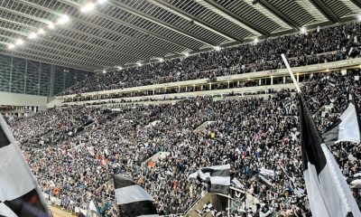 fans waving scarves pre match milburn stand sjp newcastle united nufc 1120 768x432 1